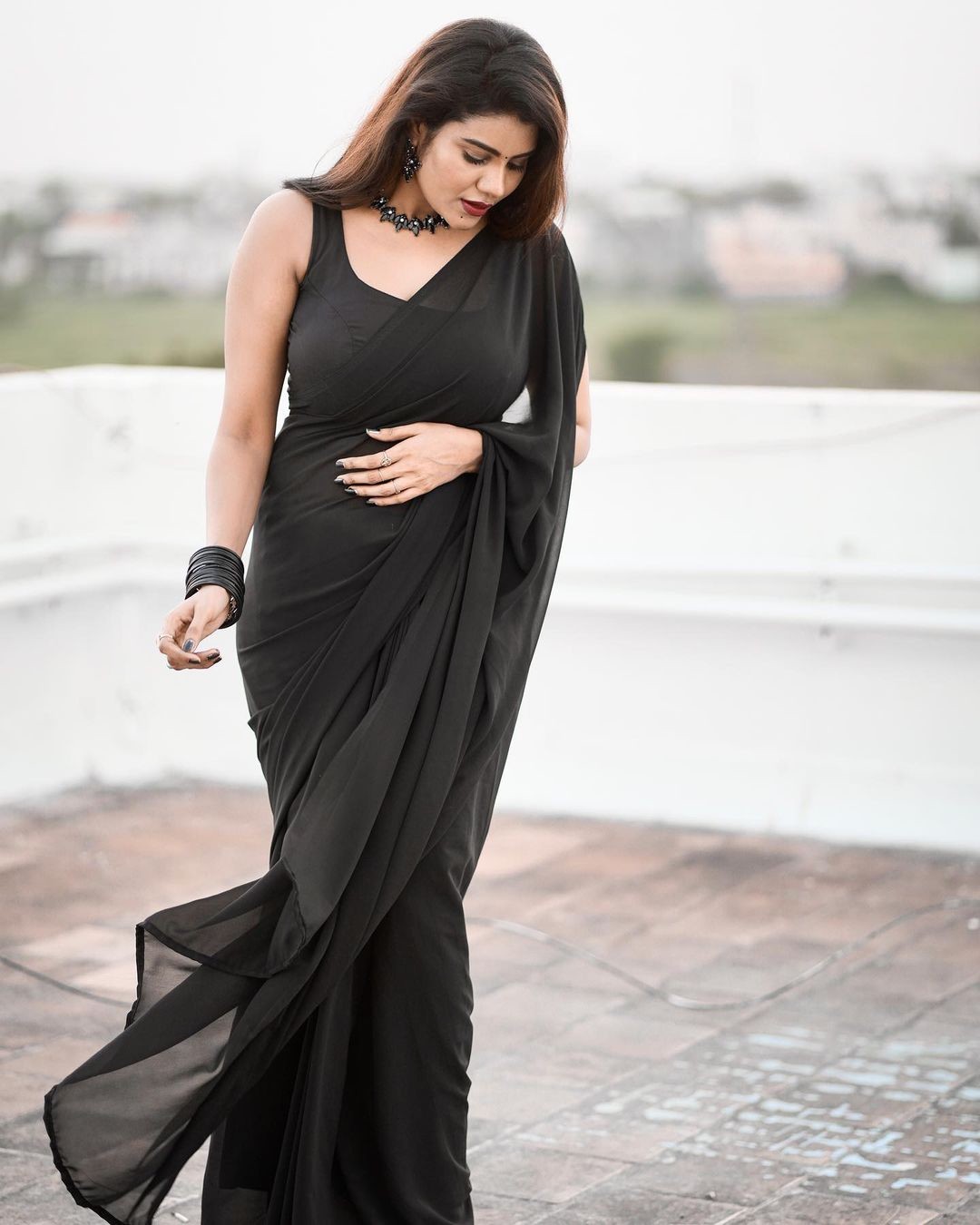Stunning Nivisha in a black saree.
